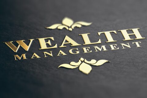 the words wealth management written on a paper